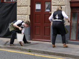Performers on Vittoria Street, part of Moving Parts performance